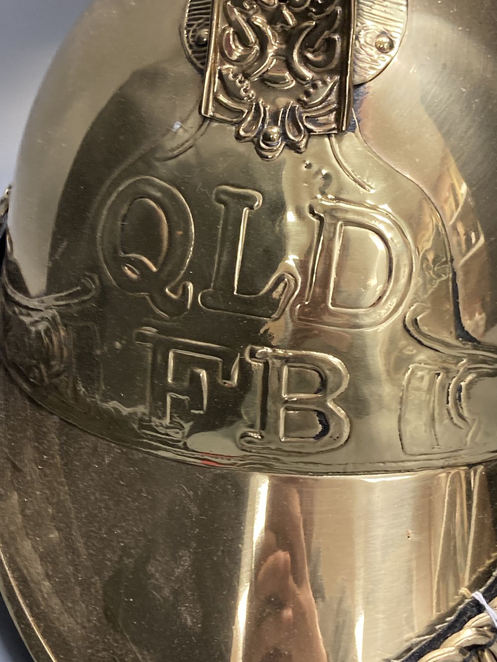 A reproduction brass firemans helmet, height 27cm